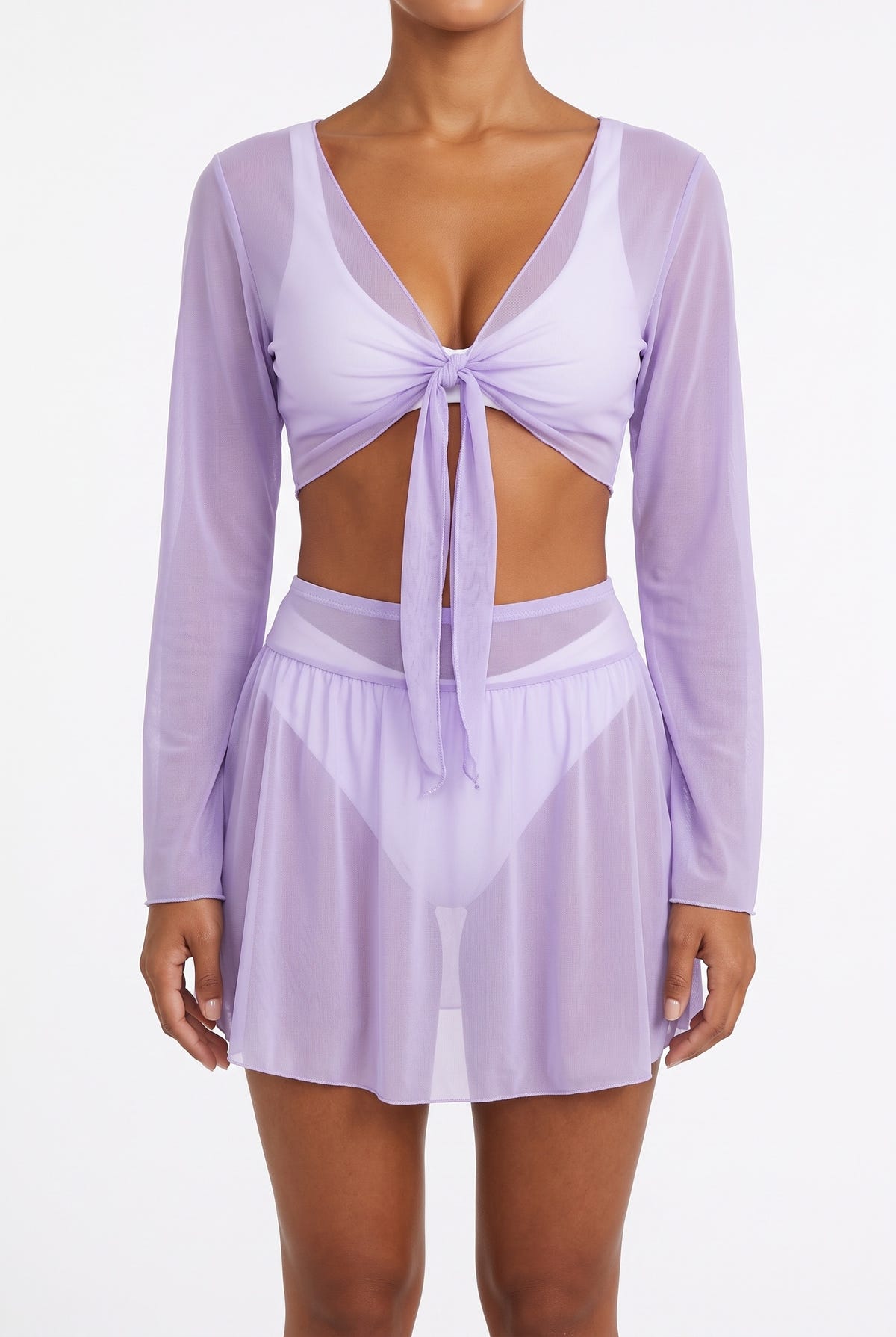 Model wearing lilac sheer long-sleeve tie-front crop top with lilac mesh mini skirt, front view