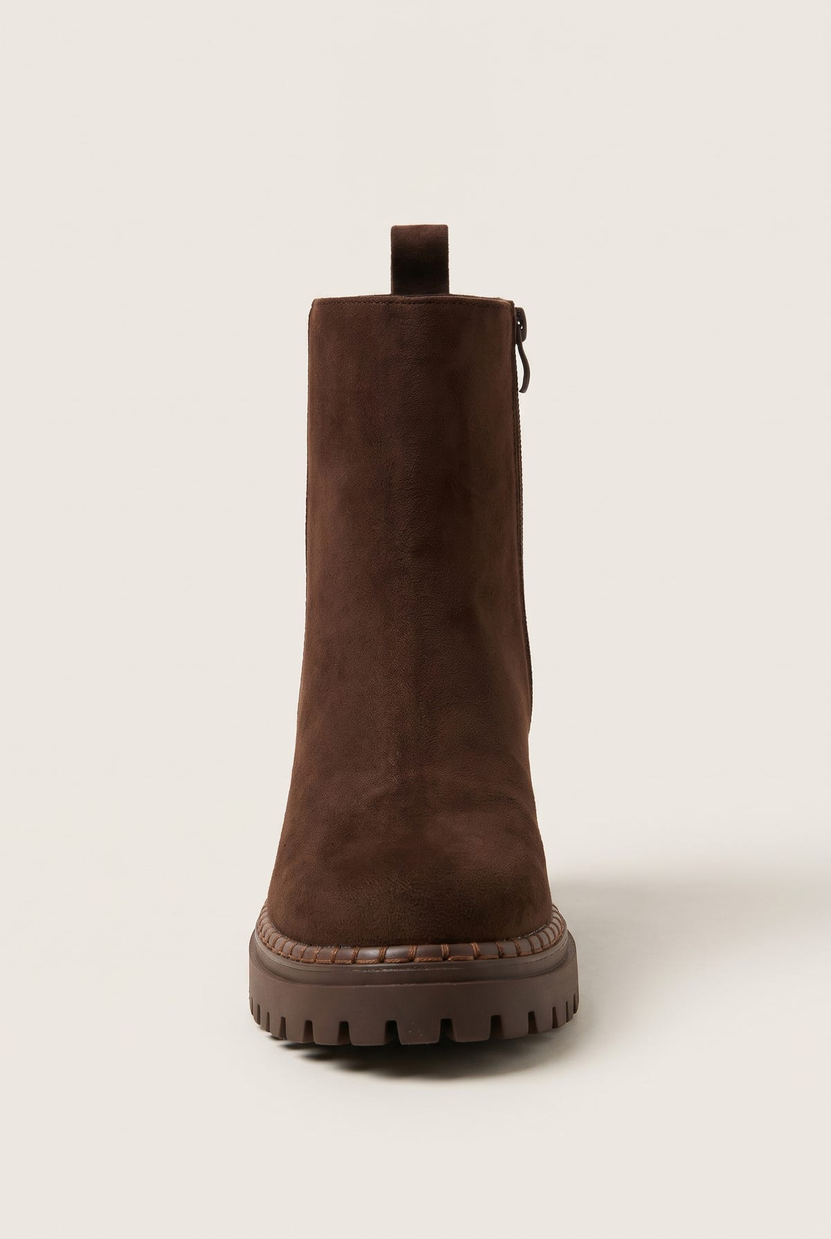 Back view of mocha brown suede ankle boot with center pull tab at the heel and rugged lugged sole edge