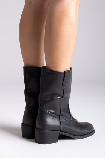 Black leather mid-calf boots with block heel and side panel, pair in front view on a model's legs in studio light