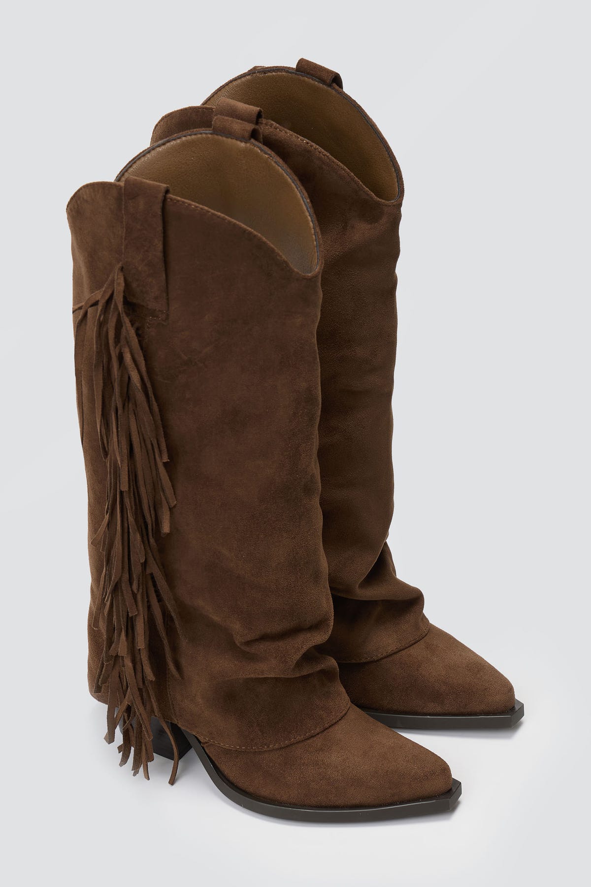 Dark brown suede fringe knee-high western boots with block heel, pair view on grey background