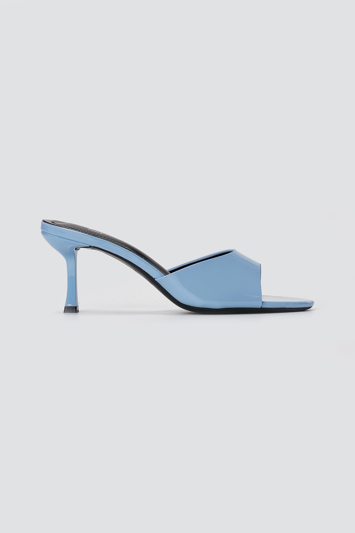 Light blue patent mule sandal with square open toe, wide front band and flared slim heel, side view