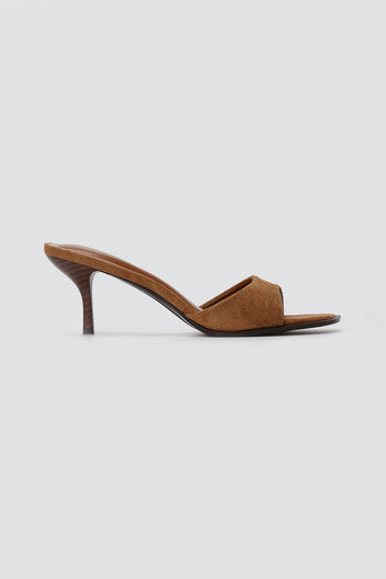Tan suede heeled mule with square open toe, wide front band and wood-effect slim heel, side view