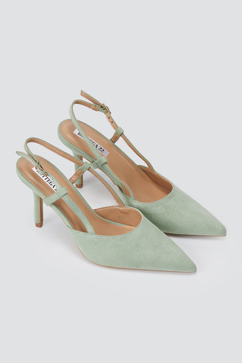 Pair of mint green suede slingback pumps, three-quarter view, pointed toes, thin cross straps and stiletto heels