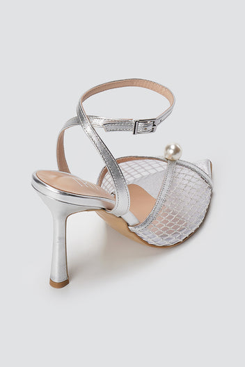 Silver metallic sandal with clear mesh front, pearl bead, ankle strap and slim high heel, back three-quarter view