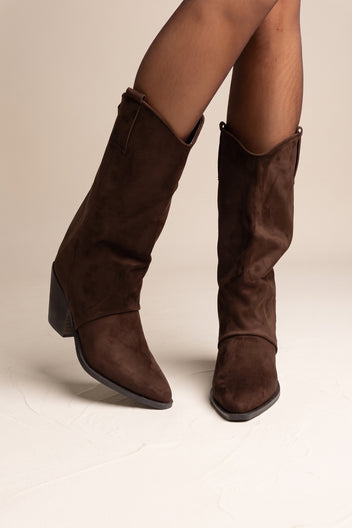 Model legs wearing brown suede western gaiter boots with folded tops and block heels