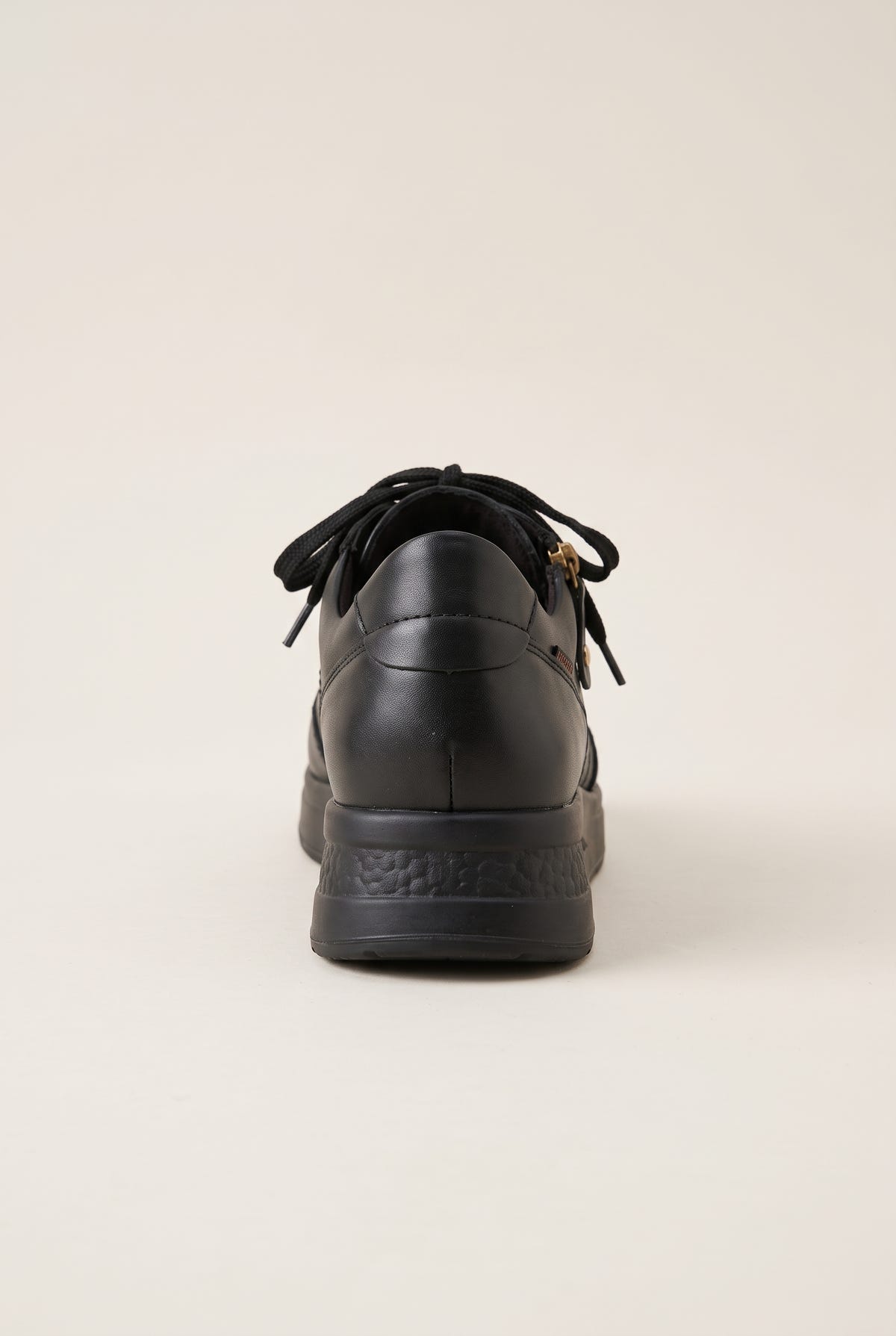 Black leather lace-up wedge sneaker with side zip and thick wedge sole, back view
