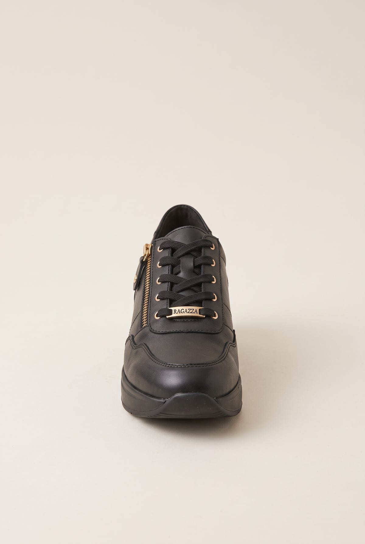 Black leather lace-up wedge sneaker with side zip and gold lace tip detail, front view