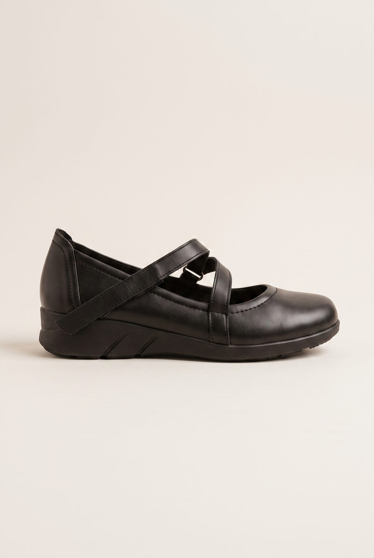 Black leather Mary Jane flatform flat with crossover velcro straps and rounded toe, side view