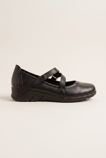Black leather Mary Jane flatform flat with crossover velcro straps and rounded toe, side view