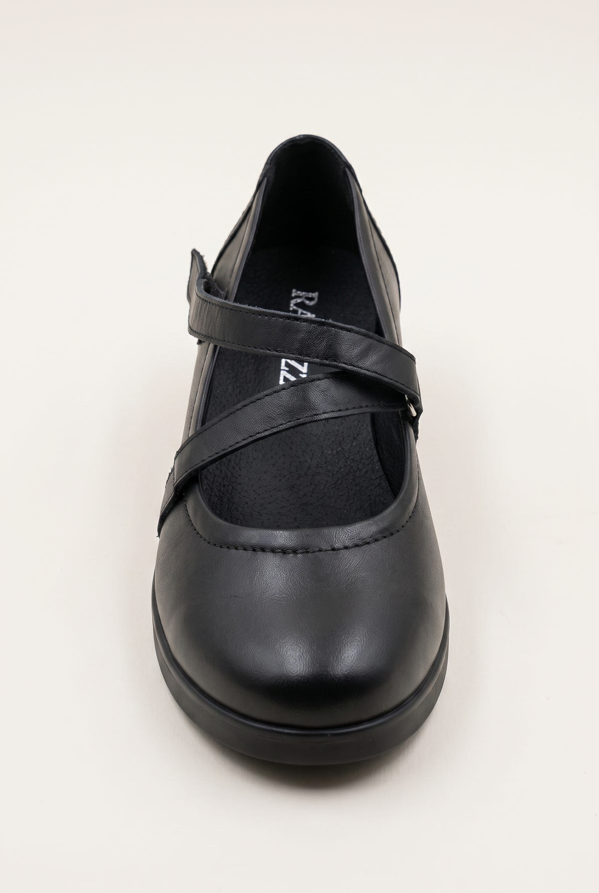Black leather Mary Jane flat with crossover strap and rounded toe, angled front view