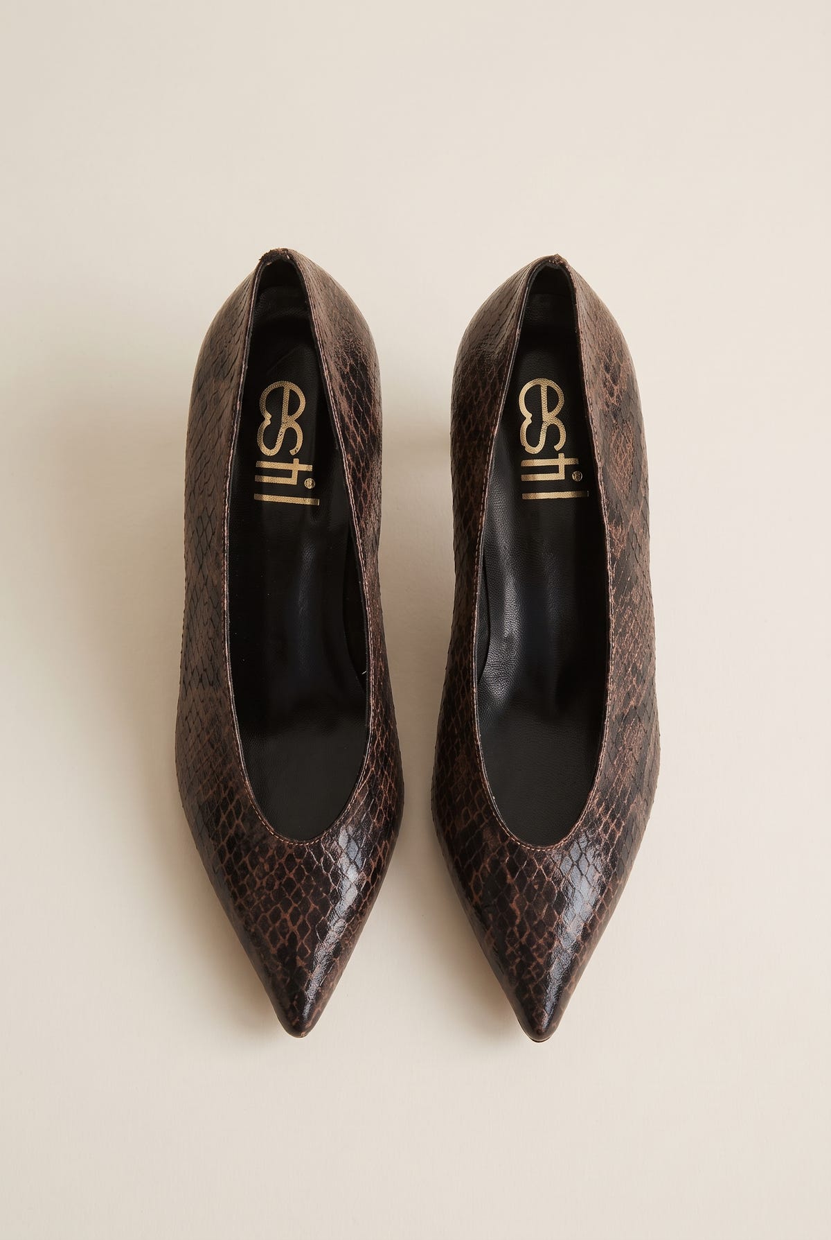 Top view of brown snake-print pointed pumps with brown insoles and a deep V-shaped vamp