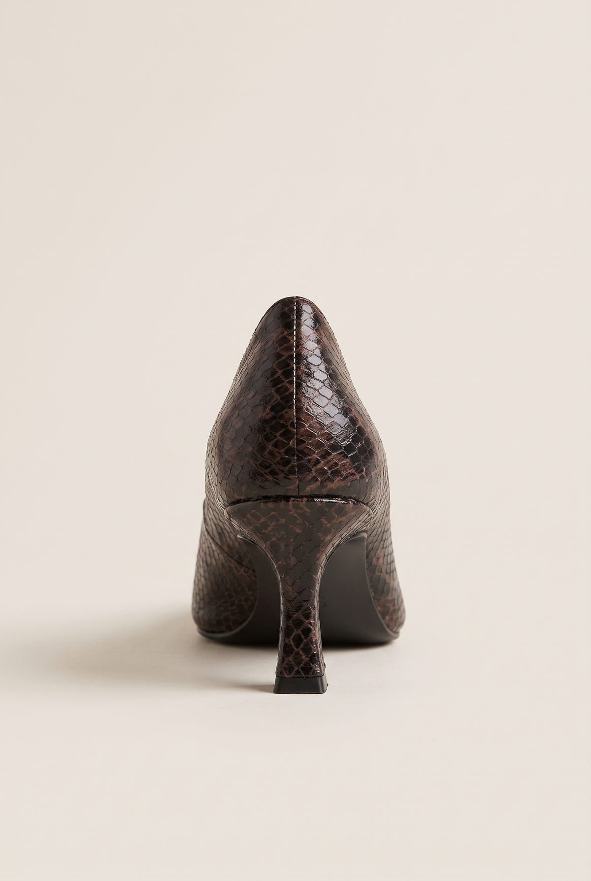 Back view of brown snake-print kitten heel pump showing the pointed heel counter and slim heel