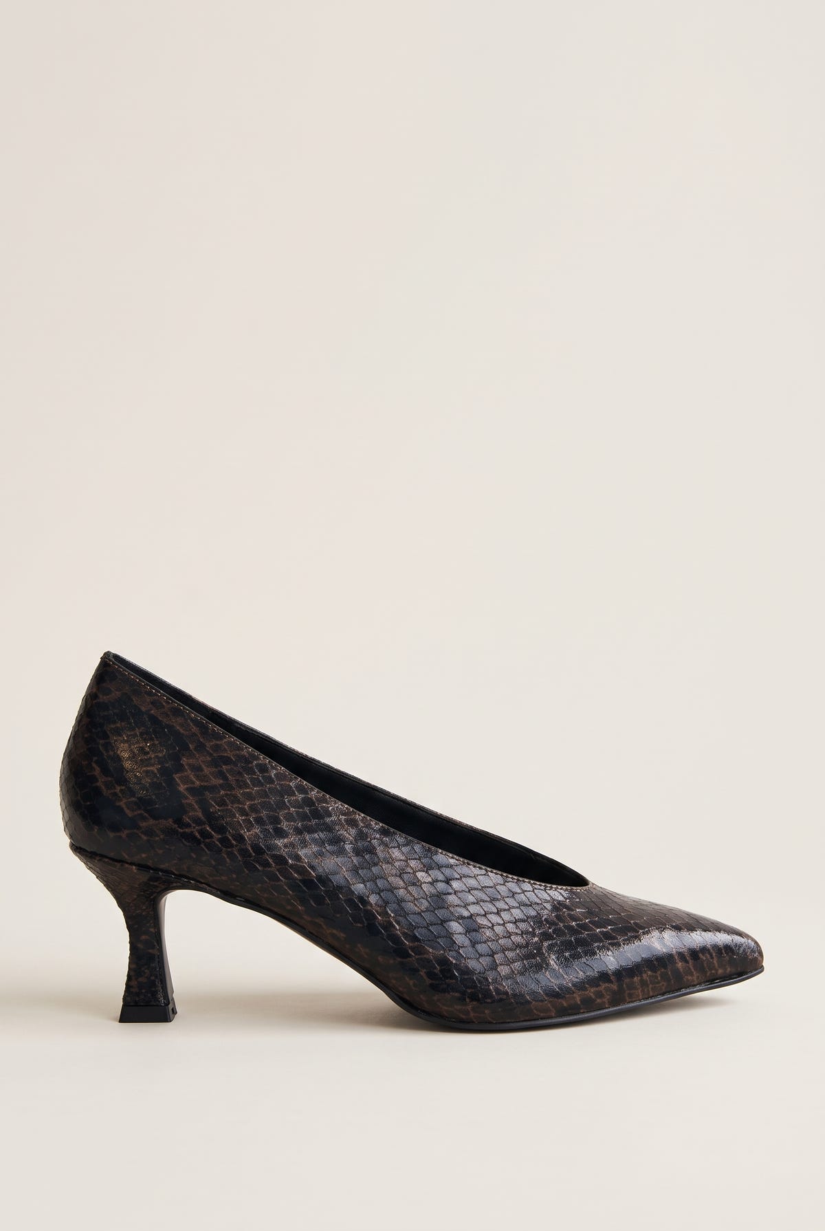 Side view of brown snake-print pointed pump with a slim kitten heel and low-cut vamp