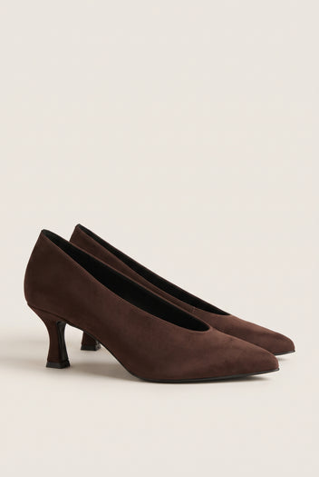 Pair of brown suede pointed-toe kitten heel pumps placed side by side on a light surface