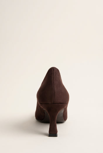 Back view of brown suede pump with a smooth heel counter, slim kitten heel and clean rounded sole edge
