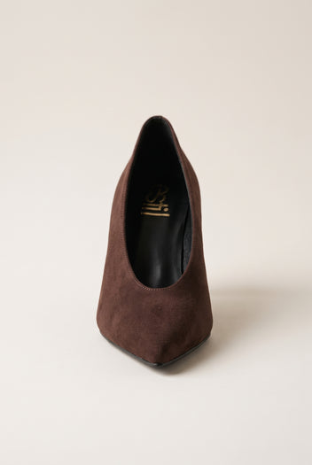 Front view of brown suede pump showing the narrow pointed toe and smooth low-cut vamp