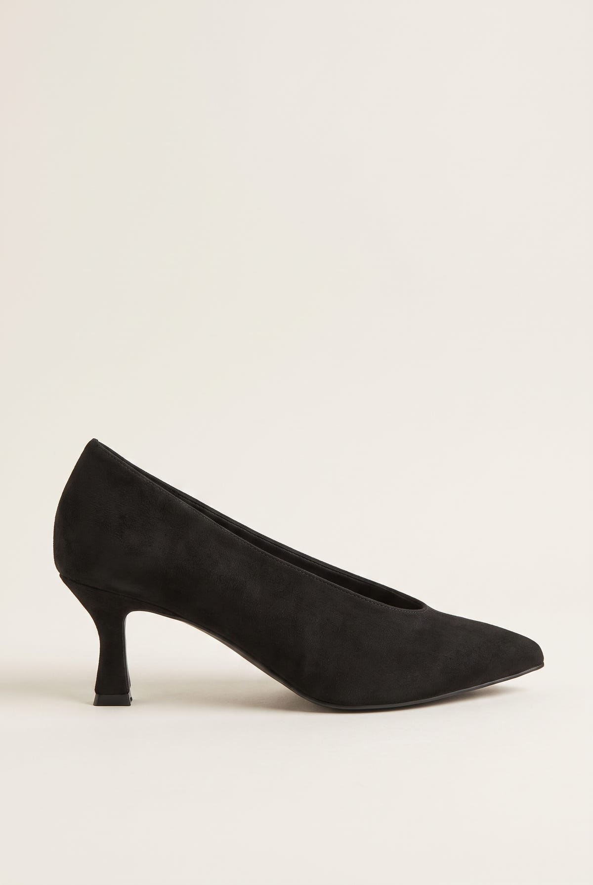 Side view of black suede pointed-toe pump with a low-cut vamp and a slim kitten heel
