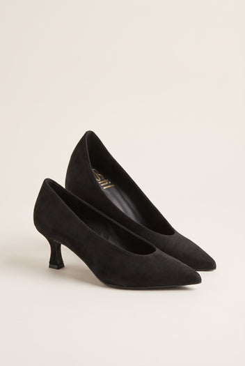 Pair of black suede pointed-toe kitten heel pumps placed side by side with toes pointing to the left