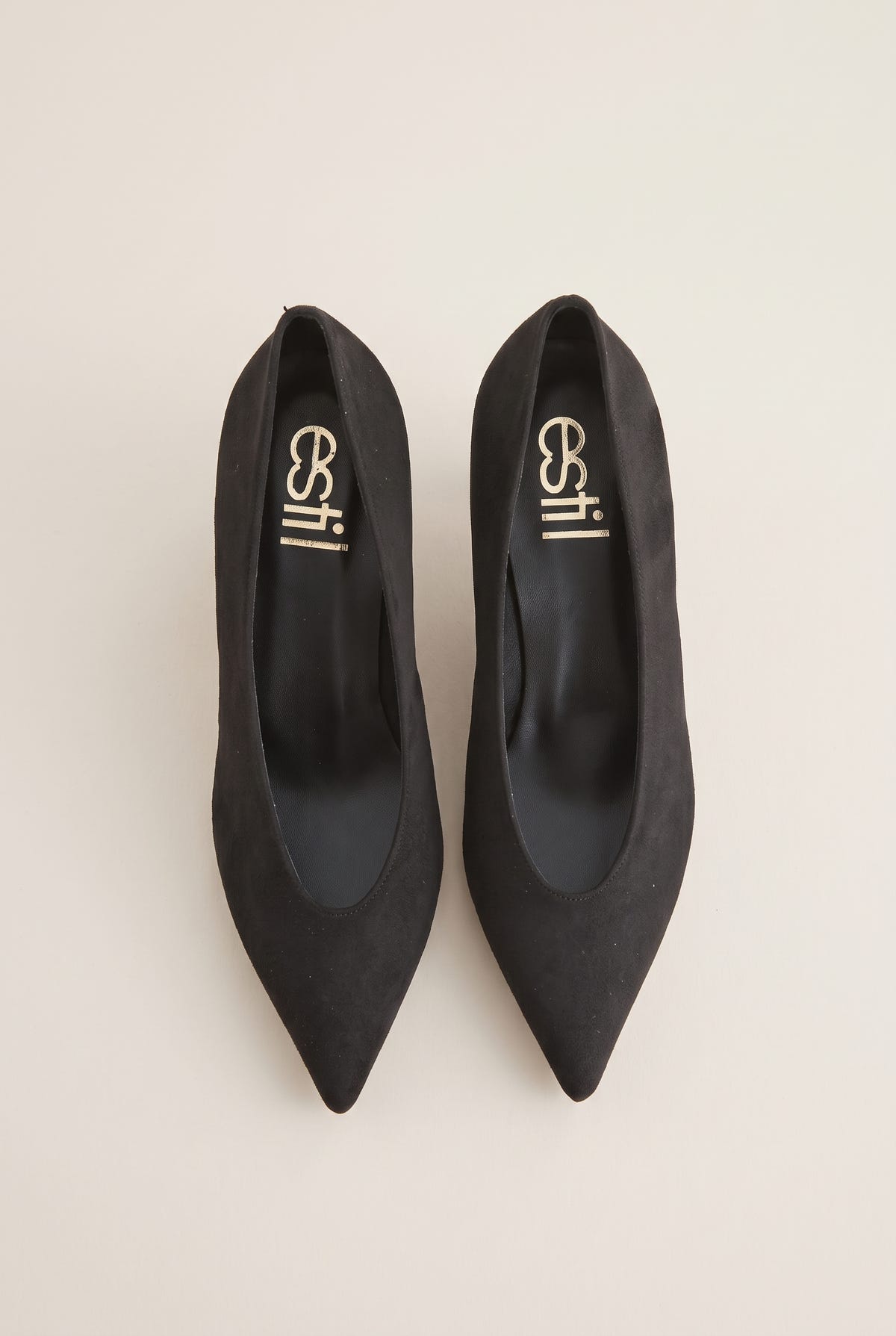 Top view of black suede pointed pumps with a low-cut vamp and black leather insoles