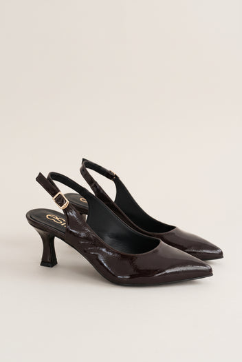 Pair of brown patent slingback pumps with buckled straps and pointed toes, seen from the side