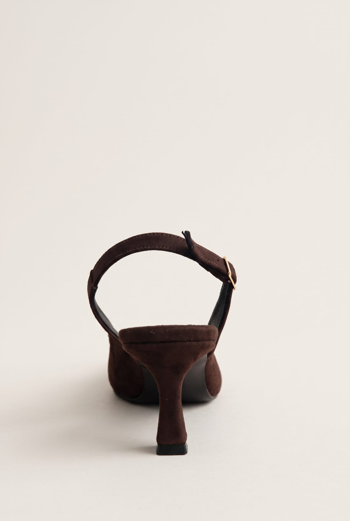 Back view of brown suede slingback showing the strap across the heel and the pointed heel counter
