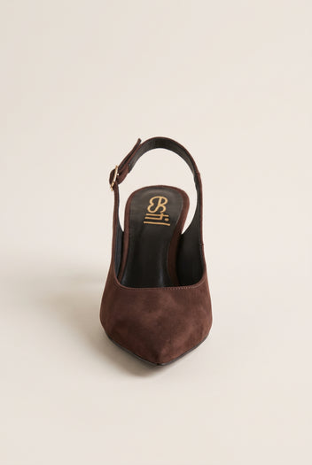 Front view of brown suede slingback pump showing the pointed toe and strap behind the heel