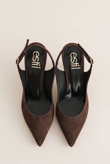 Top view of brown suede slingback pumps with buckled straps, pointed toes and dark leather insoles