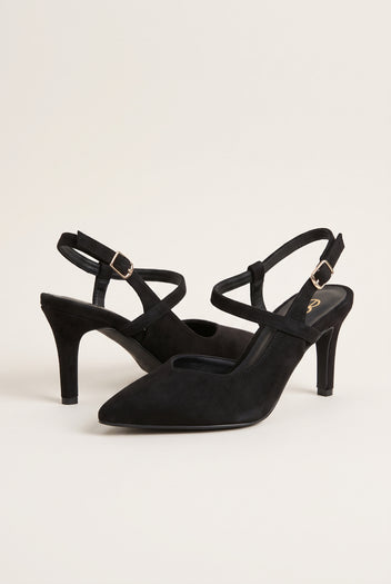 Angled view of black suede slingback pumps showing crossed straps, pointed toes and slim heels