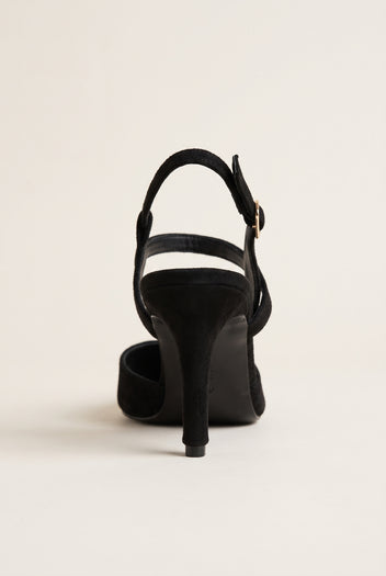 Back view of black suede slingback pump with slim stiletto heel and strap wrapping the heel counter
