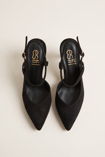 Top view of black suede pointed slingback pumps with narrow heel straps and buckled ankle details
