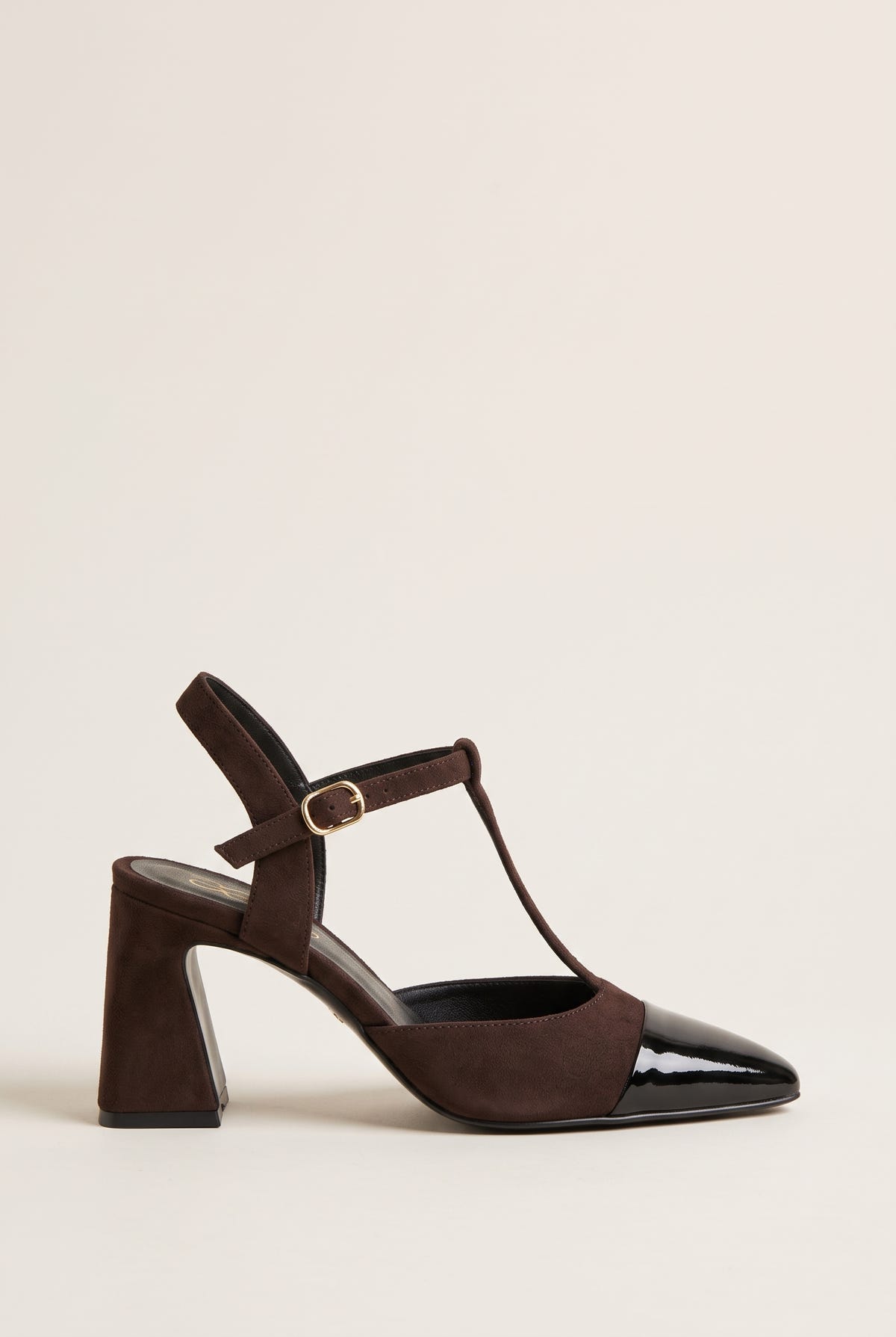 Chocolate suede block heel pump with black patent pointed toe cap and T-strap buckle, side view
