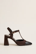 Chocolate suede block heel pump with black patent pointed toe cap and T-strap buckle, side view