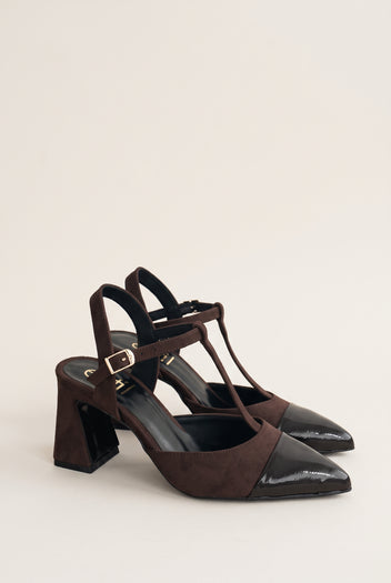 Pair of chocolate suede block heel pumps with black patent toe caps and T-straps, angled three-quarter view