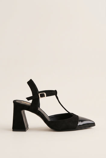Black suede and patent T-strap pump with patent toe cap and buckle ankle strap in side view