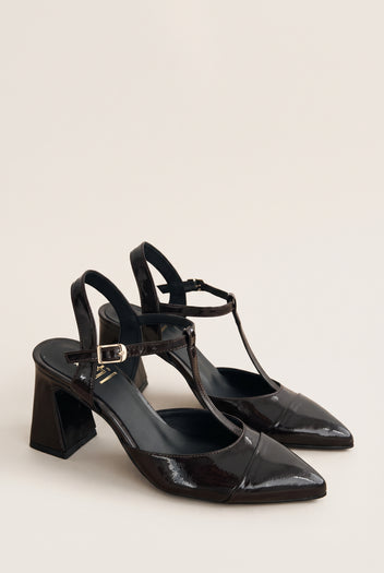 Pair of brown patent T-strap pumps in angled view showing ankle straps and flared block heels