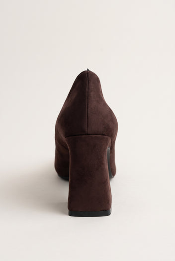 Rear view of brown suede pump showing chunky block heel, smooth back counter and thin dark sole