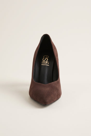 Brown suede pump seen from the front showing narrow pointed toe and tapered vamp