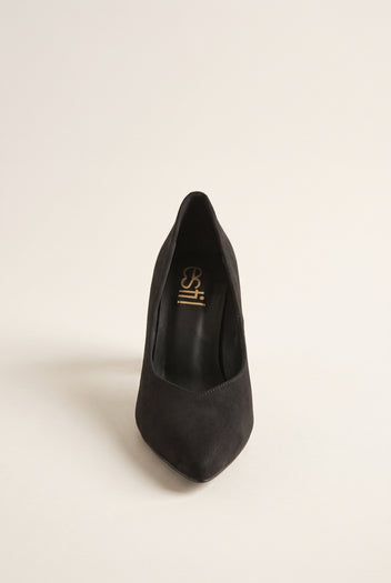 Black suede pump seen from the front showing narrow pointed toe and tapered vamp