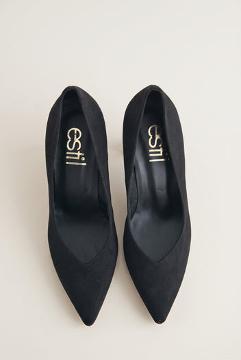 Top view of black suede pointed-toe pumps showing narrow tapered toes and padded insole