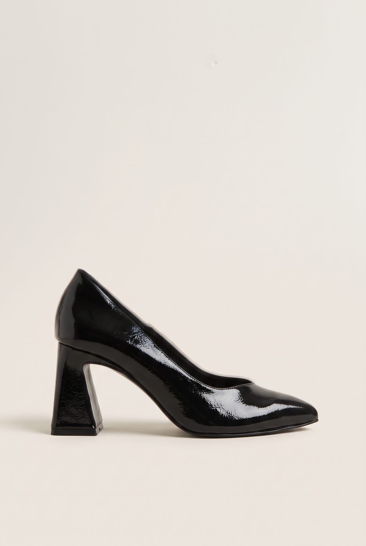 Black patent leather pointed-toe pump with low-cut vamp and flared block heel in side profile view