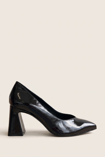 Brown patent pointed-toe pump in side profile with flared block heel and glossy finish