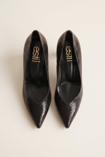 Pair of black snake-embossed pumps viewed from above showing narrow pointed toes and padded insole