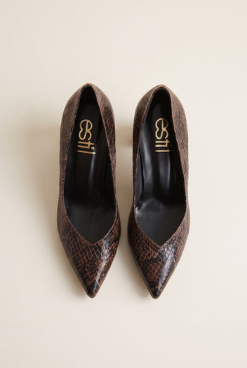 Top view of brown snake-print pointed-toe pumps showing narrow toes and padded insole