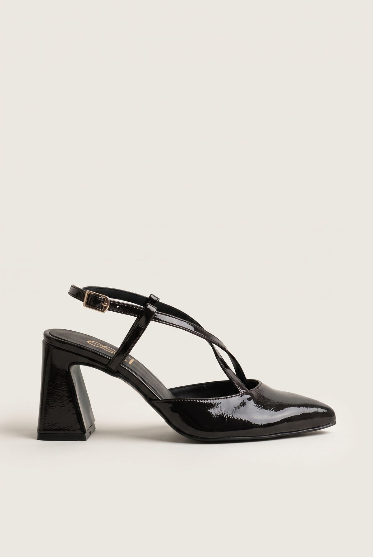 Side view of a single brown patent slingback pump with a pointed toe, thin crossed strap over the instep and a flared block heel