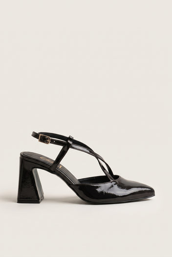 Side view of a single brown patent slingback pump with a pointed toe, thin crossed strap over the instep and a flared block heel