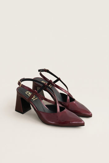 Angled pair of bordeaux patent slingback pumps with block heels and pointed toes