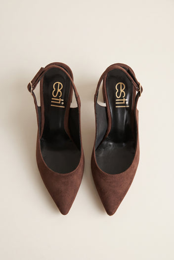 Top view of a pair of brown suede slingback pumps with pointed toes, dark insoles and slim straps lying open