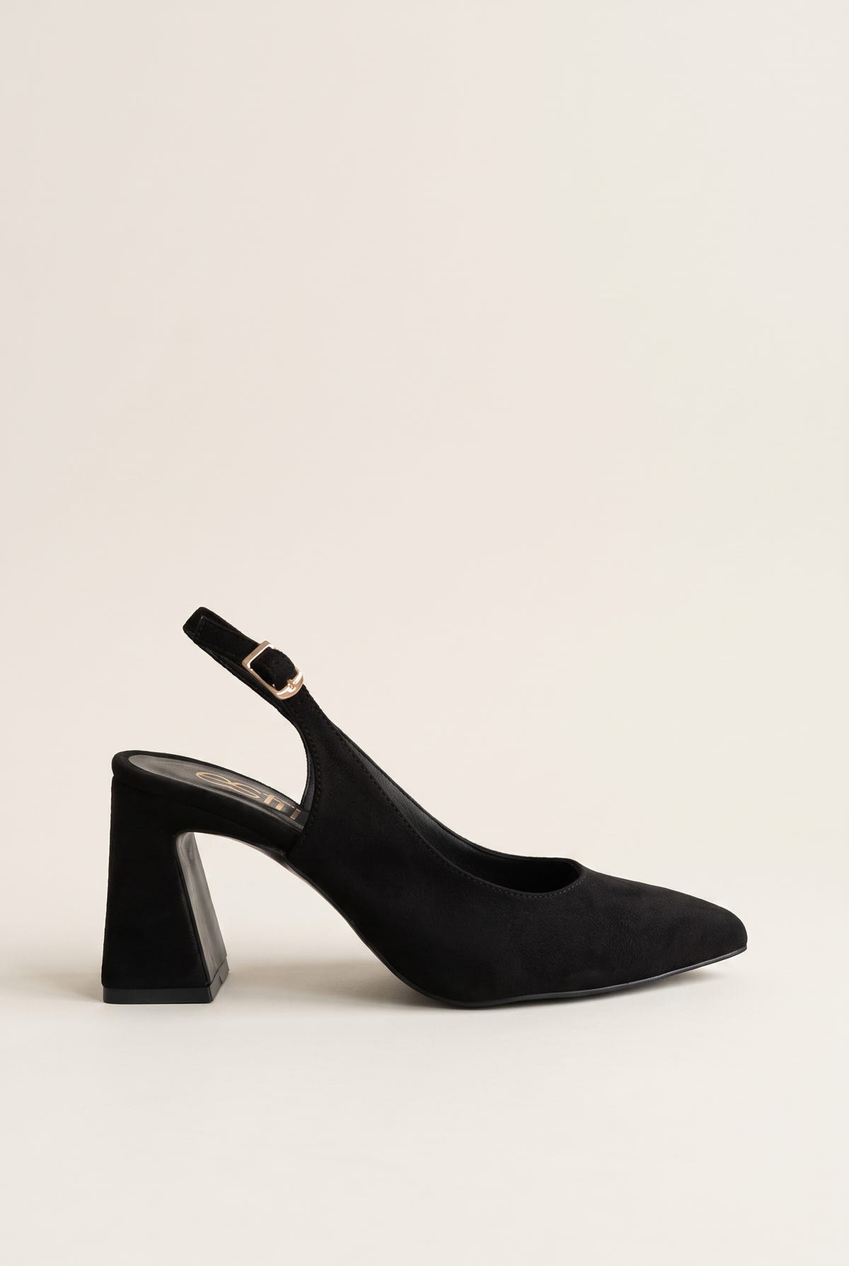 Side view of a black suede slingback pump with a pointed toe, block heel and gold buckle on the ankle strap