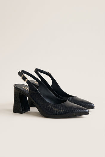Pair of black snake-embossed pointed-toe slingback pumps with block heels in a side view on a plain white surface