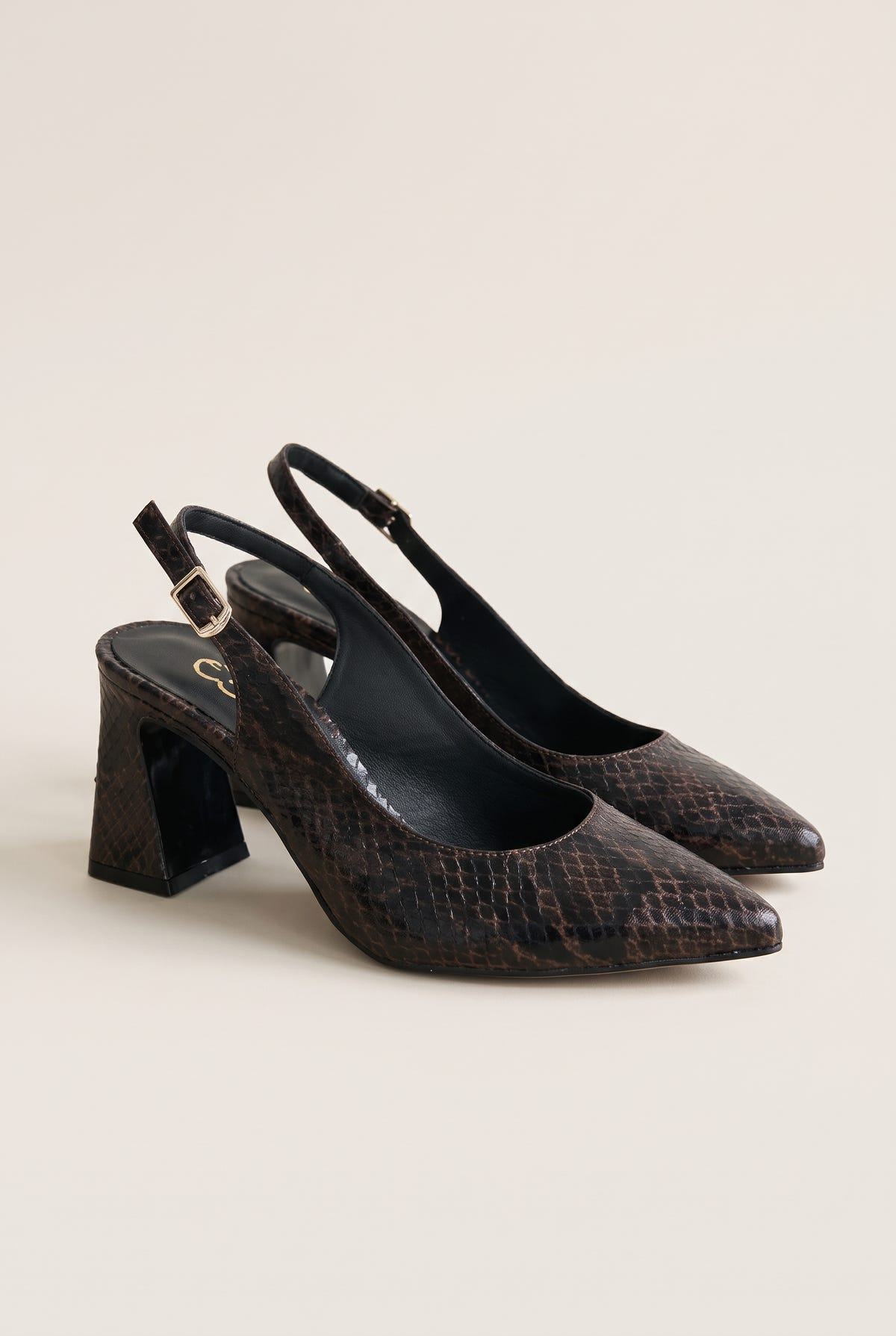 Pair of brown snake-print slingback pumps with pointed toes and block heels, side by side in a tilted view on white